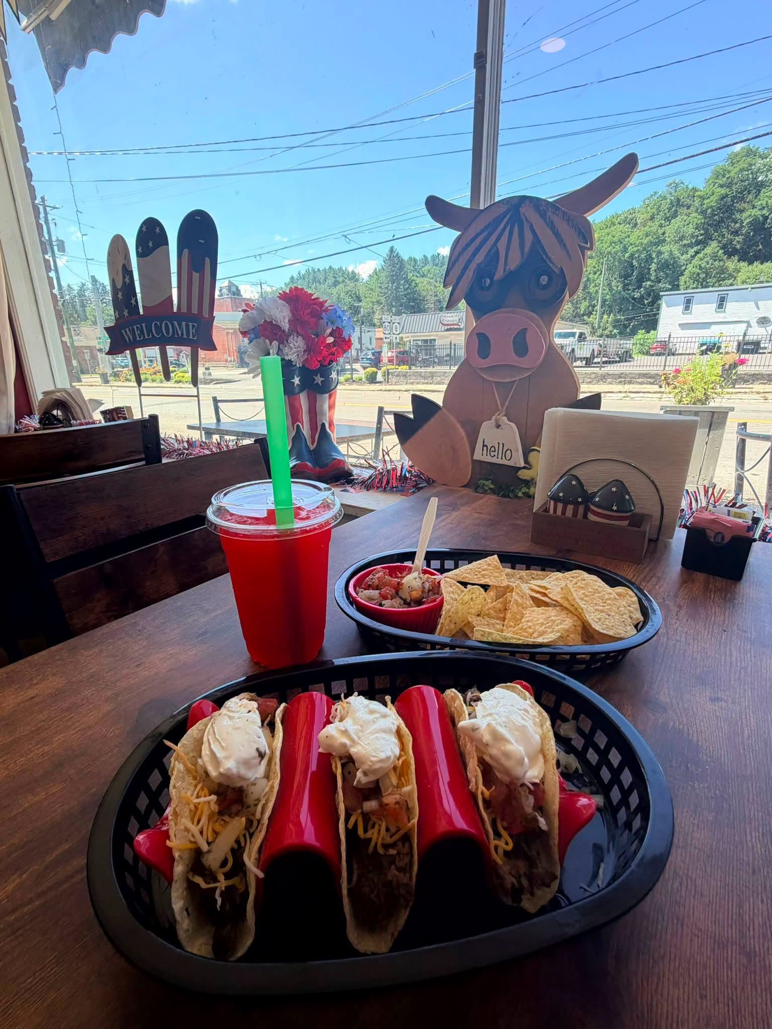 Street tacos and chips on the table by the front window
